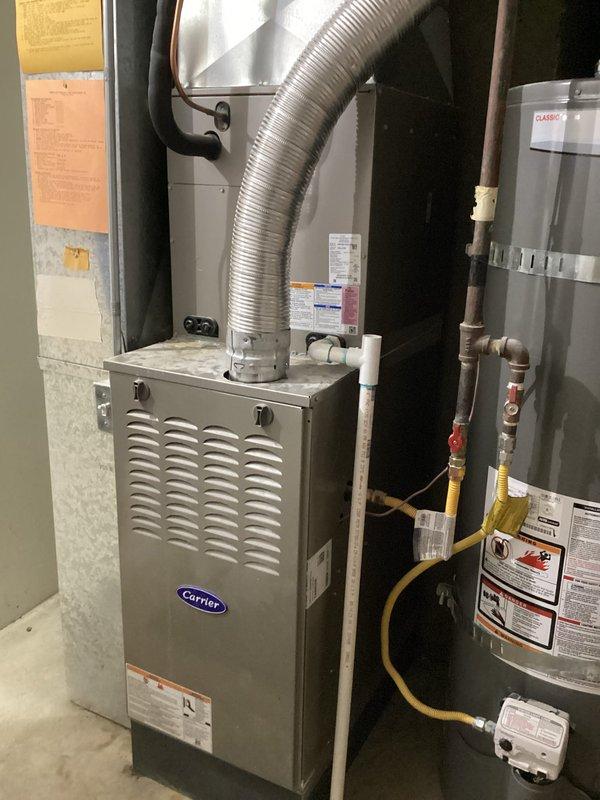 Completed scheduled Green Shield cooling maintenance on 3-year-old Carrier HVAC system with outdoor condensing unit and basement furnace installation. Performed comprehensive system inspection with no reported issues from customer. Verified electrical amperage readings at 94 amps using clamp meter, inspected all accessible equipment components including furnace cabinet, ductwork connections, and associated water heater plumbing in mechanical room. All equipment operating within normal parameters with proper airflow and no deficiencies noted during routine maintenance visit.