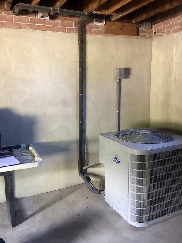 Responded to no cooling complaint on 11-year-old residential air conditioning system with outdoor condenser located in backyard and Carrier furnace in basement. Performed diagnostic evaluation of single-zone HVAC system to identify cause of insufficient cooling. Documented equipment condition and provided estimate for necessary repairs or replacement options to restore proper system operation.