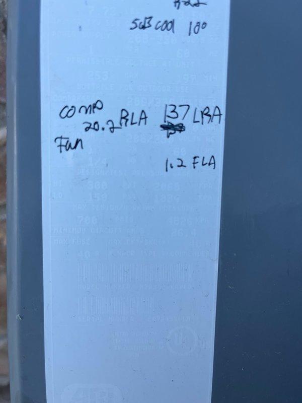 Responded to no cooling complaint on 17-year-old single-zone HVAC system. Upon arrival, confirmed outdoor condenser fan motor operating but unit not producing cold air with no visible frost or ice formation. Performed diagnostic evaluation and identified failed capacitor with visible oil leakage. Recorded equipment nameplate data including compressor specifications (20.7 RLA, 137 LRA) and fan motor ratings (1.2 FLA) for proper replacement sizing. Verified compressor operation and electrical connections. Installed turbo capacitor as replacement with five-year warranty coverage. Tested system operation using clamp meter, confirming proper amperage draw of 102.4 amps AC. System restored to full cooling operation and left running normally.