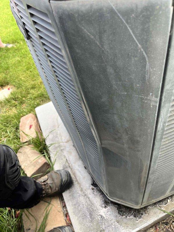 Responded to no-cooling call on residential split system with 20+ year-old equipment. Performed comprehensive Cool 10+ preventive maintenance inspection on outdoor condenser unit and indoor air handler located in basement. Outdoor unit showed significant weathering and surface wear consistent with age; inspected electrical connections, refrigerant lines, and condenser coil condition. Indoor inspection revealed heavily soiled air filter with substantial dust and particulate accumulation restricting airflow. Replaced dirty air filter with new unit to restore proper system airflow and efficiency. Verified system operation and cooling performance upon completion of maintenance service.