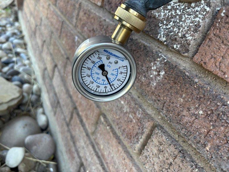 Responded to no hot water complaint on 8-9 year old tanked water heater located in basement. Upon arrival, confirmed pilot light would not ignite and observed three red error indicator lights blinking on the control module. Performed diagnostic evaluation of the gas control valve, thermocouple, and ignition system to identify failure point. Tested incoming gas pressure using calibrated gauge to verify adequate supply to unit. Inspected venting system and combustion chamber for blockages or safety concerns. Diagnosed faulty gas control valve assembly preventing pilot ignition and causing error code display. Reviewed repair versus replacement options given age of unit and extent of required repairs.