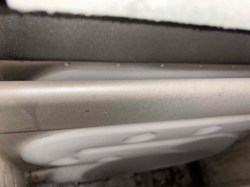 Responded to no cooling complaint on 29-year-old single-zone system with outdoor condenser at ground level and furnace in basement. Customer reported unit running but no cool air through vents, with previous freezing condition that had since cleared. Upon arrival, performed comprehensive Cool 10+ diagnostic evaluation including visual inspection of both indoor and outdoor components. Inspection revealed significant black contamination and sooty buildup on interior ductwork surfaces near air handler, indicating potential mold growth or environmental deposits requiring attention. Examined refrigerant lines showing normal condition with proper insulation intact. Conducted system performance testing to evaluate airflow, refrigerant pressures, electrical components, and blower motor operation. Assessed control board functionality and verified proper system cycling. Documented findings with photographic evidence of ductwork contamination and refrigerant line configuration for service records