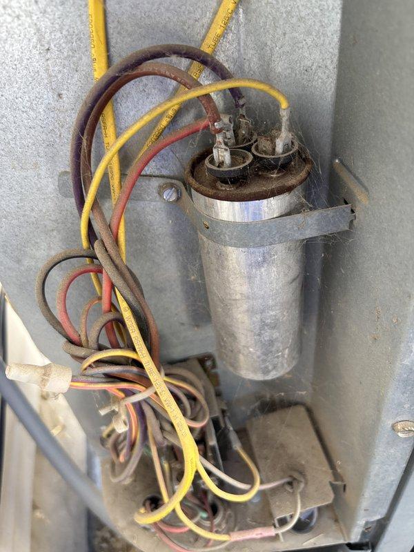 Responded to cooling complaint with inadequate upstairs temperature. Upon initial inspection, found evaporator coil frozen and allowed system to thaw, requiring return visit the following day. Completed Cool 10+ preventive maintenance service on single-zone residential air conditioning system. Performed comprehensive system inspection including capacitor testing, which measured 591 microfarads within acceptable range. Evaluated airflow distribution concerns between upper and lower levels of residence. Inspected outdoor condensing unit at ground level and indoor furnace/air handler located downstairs. System operational following thaw period with all electrical components functioning properly.