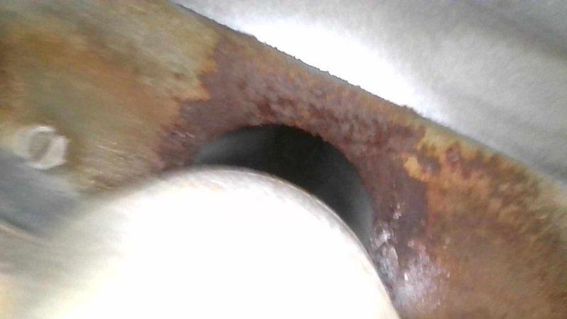 Completed Cool 10+ preventative maintenance inspection on residential HVAC system. Documented significant corrosion on copper refrigerant lines and heavy dust and debris accumulation on evaporator coil fins, indicating extended period without maintenance. Photographed corroded piping showing oxidation progression and deteriorated heat exchanger surfaces with brownish buildup restricting airflow between fins.