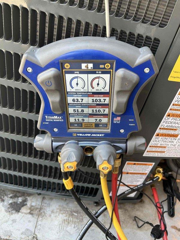 Completed full HVAC system installation including Goodman GLXS3BN2410 air conditioning unit and CAPTA2422B3 evaporator coil in downflow configuration. Installed outdoor condensing unit on new EL3030-3 equipment pad with proper leveling and positioning. Mounted evaporator coil with custom sheet metal fabrication to accommodate 5-inch filter cabinet as requested for enhanced filtration capacity.

Flushed and reused existing lineset to connect outdoor and indoor components. Performed nitrogen purge and pressure testing to verify system integrity. Evacuated refrigeration system to proper vacuum levels and charged with R-410A refrigerant to manufacturer specifications. Verified proper refrigerant charge using manifold gauges, confirming suction temperature of 63.7°F, liquid temperature of 103.7°F, saturation temperatures of 51.8°F suction and 110.7°F discharge, with appropriate superheat and subcooling values.

Installed 16x25x5 MERV 11 filter cabinet with custom sheet metal transition to a