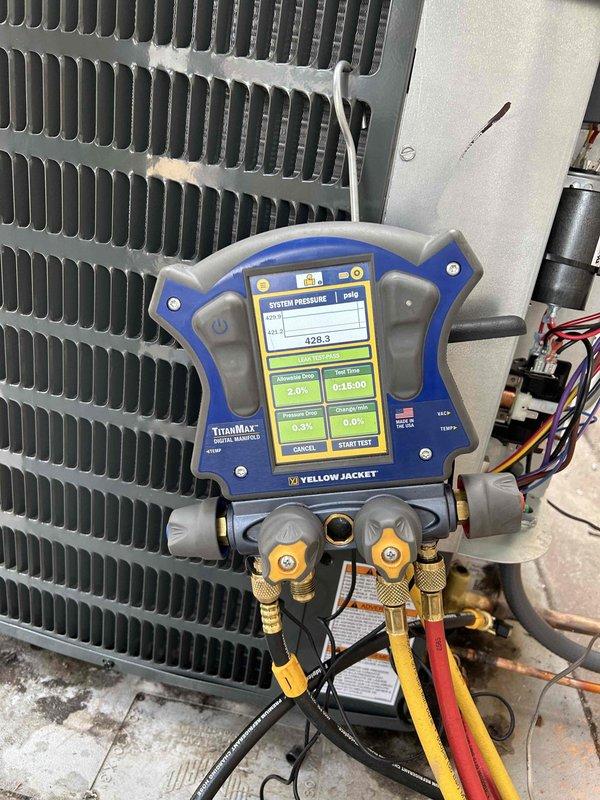 Completed full HVAC system installation including Goodman GLXS3BN2410 air conditioning unit and CAPTA2422B3 evaporator coil in downflow configuration. Installed outdoor condensing unit on new EL3030-3 equipment pad with proper leveling and positioning. Mounted evaporator coil with custom sheet metal fabrication to accommodate 5-inch filter cabinet as requested for enhanced filtration capacity.

Flushed and reused existing lineset to connect outdoor and indoor components. Performed nitrogen purge and pressure testing to verify system integrity. Evacuated refrigeration system to proper vacuum levels and charged with R-410A refrigerant to manufacturer specifications. Verified proper refrigerant charge using manifold gauges, confirming suction temperature of 63.7°F, liquid temperature of 103.7°F, saturation temperatures of 51.8°F suction and 110.7°F discharge, with appropriate superheat and subcooling values.

Installed 16x25x5 MERV 11 filter cabinet with custom sheet metal transition to a
