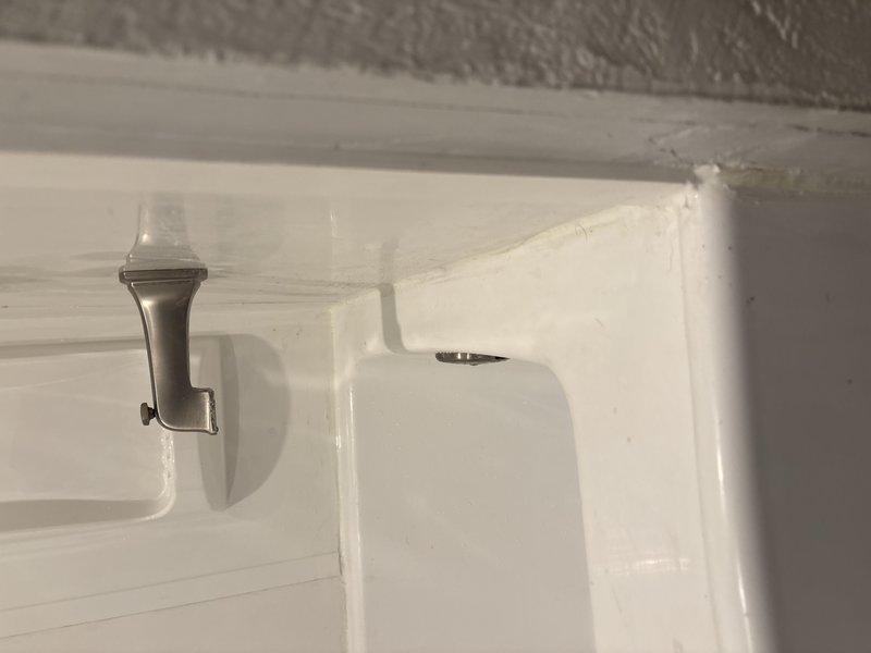 Returned to address tub spout issue from previous installation work. Repaired and secured brushed nickel tub spout fixture to ensure proper function and mounting stability. Verified shower diverter operation and confirmed all bathroom fixtures were working correctly upon completion.