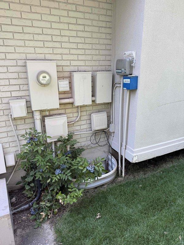 Responded to no-cooling complaint on 25-year-old residential air conditioning system with furnace located in basement. Performed diagnostic inspection on right-side condenser unit and associated air handler to determine cause of system failure. Upon evaluation, identified multiple component failures requiring system replacement, documented equipment condition with photographic evidence of exterior condenser location and basement furnace installation, and provided comprehensive replacement estimate for failed HVAC system.
