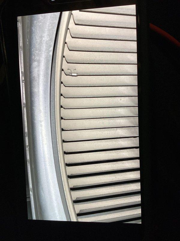 Performed Cool 10+ preventive maintenance on a 10-year-old single-zone residential HVAC system with International Comfort Products furnace model N9MSE0802120A2 (manufactured February 2016, 90,000 BTU input). Inspected and photographed evaporator coil assembly showing minor dust accumulation on aluminum fins but no significant blockage. Verified system operation in response to cooling performance concerns and excessive runtime complaints. Completed standard maintenance protocol including visual inspection of accessible components, documentation of equipment nameplate data, and assessment of indoor unit condition in downstairs mechanical room with outdoor condenser located on side of home.
