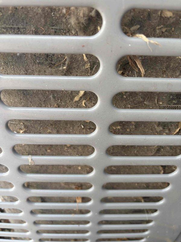 Responded to cooling complaint regarding inadequate airflow to upper level while basement maintained proper temperature. Upon inspection, found heavily soiled return air grille with significant dust and debris accumulation restricting airflow. Accessed evaporator coil assembly and identified dirty coil fins affecting heat transfer efficiency. Cleaned return grille, replaced air filter, and serviced evaporator coil to restore proper system airflow and cooling distribution throughout home.
