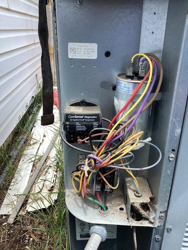 Responded to customer complaint of lukewarm air from vents and rising indoor temperatures on a 2017 single-zone residential cooling system with ground-level outdoor condenser unit. Performed comprehensive Cool 5-9 diagnostic service on the air conditioning system. Inspected outdoor condenser unit for proper operation, verified compressor function, and checked refrigerant pressures. Accessed electrical control panel and inspected CoreSense Diagnostics module, capacitor connections, and associated wiring harnesses. Evaluated system performance and identified cooling deficiency requiring further attention to restore proper temperature control.