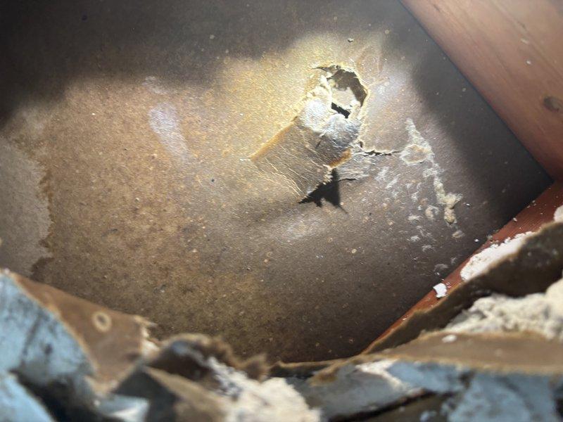 Responded to emergency water leak in kitchen where refrigerator supply line had burst during homeowner's absence, causing significant flooding and water damage to the home. Located failed supply line connection, shut off water supply to prevent further damage, and documented extent of water intrusion and structural impact. Recommended immediate water remediation services and replacement of damaged supply line with proper installation to restore water service to residence.