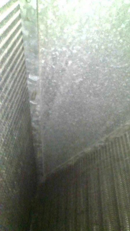 Responded to no-cooling call on residential split system approximately 25+ years old. Upon arrival, confirmed air conditioning unit was non-operational while furnace remained functional. Performed diagnostic evaluation and identified failed dual run capacitor as root cause of system failure. Replaced defective dual capacitor and restored cooling operation to unit.

During comprehensive system inspection, documented multiple concerns with existing equipment due to advanced age (1997 installation). Identified significant corrosion on furnace components and potential heat exchanger deterioration presenting safety concerns. Photographed corroded fasteners and heat exchanger surfaces showing degradation. Advised homeowner that given the age and condition of both heating and cooling equipment, the capacitor replacement represents a temporary repair solution.

Recommended full system evaluation by Comfort Consultant to assess replacement options, as continued repairs on aging equipment may no