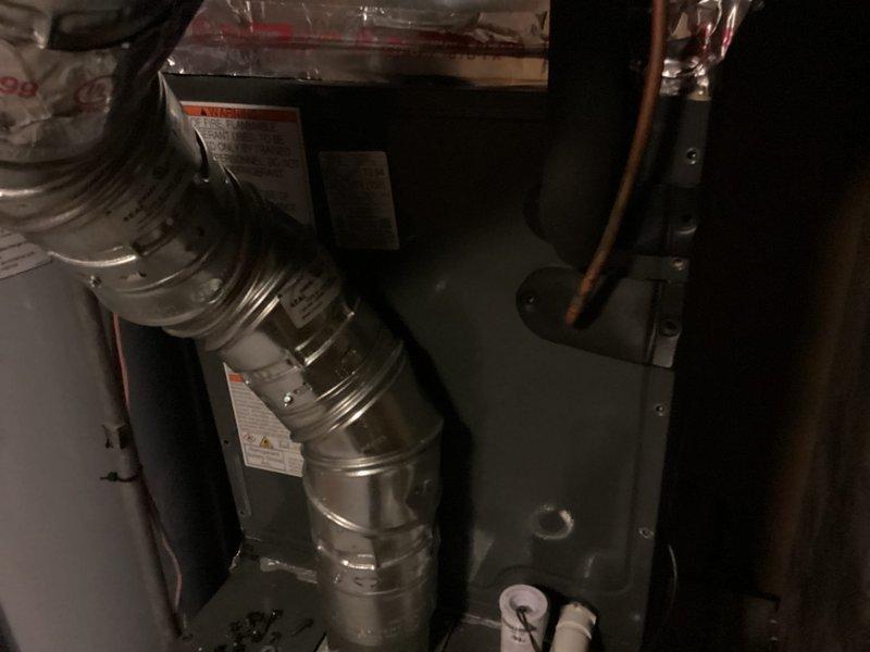 Responded to callback for 7-month-old HVAC system with reported excessive water dripping from pipe and loud noise. Inspected heat pump air handler unit model CAPTA2422B3AA located in basement utility closet along with associated ductwork and refrigerant lines. Evaluated condensate drainage system and verified proper operation of condensate pump and drain lines. Checked refrigerant lines for proper insulation and secure connections. System found operating within normal parameters with no refrigerant leaks or airflow restrictions detected.