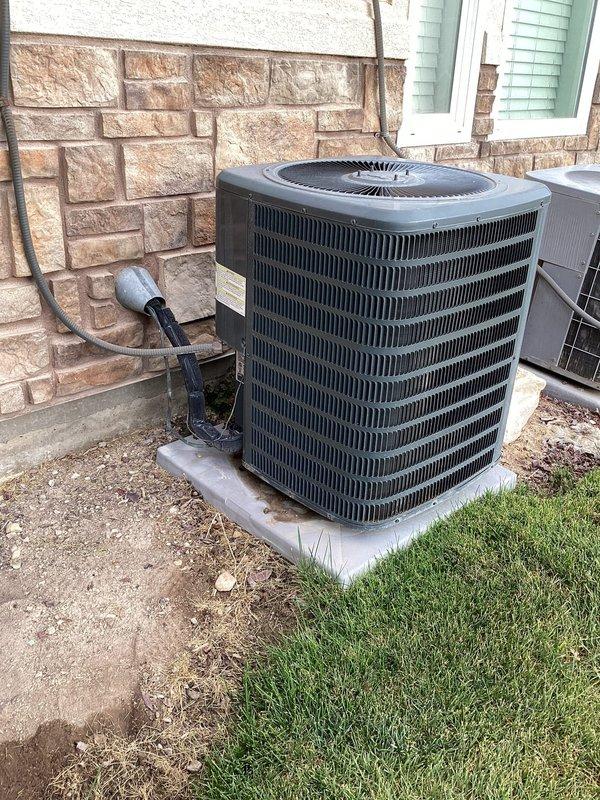 Completed preventive maintenance service on a 3-year-old residential air conditioning system located at the rear of the property with furnace access in the attic. Performed standard cooling system inspection and maintenance procedures on the outdoor condenser unit, including visual inspection of refrigerant lines, electrical connections, and overall system operation. All components found to be functioning within normal parameters during routine maintenance visit.