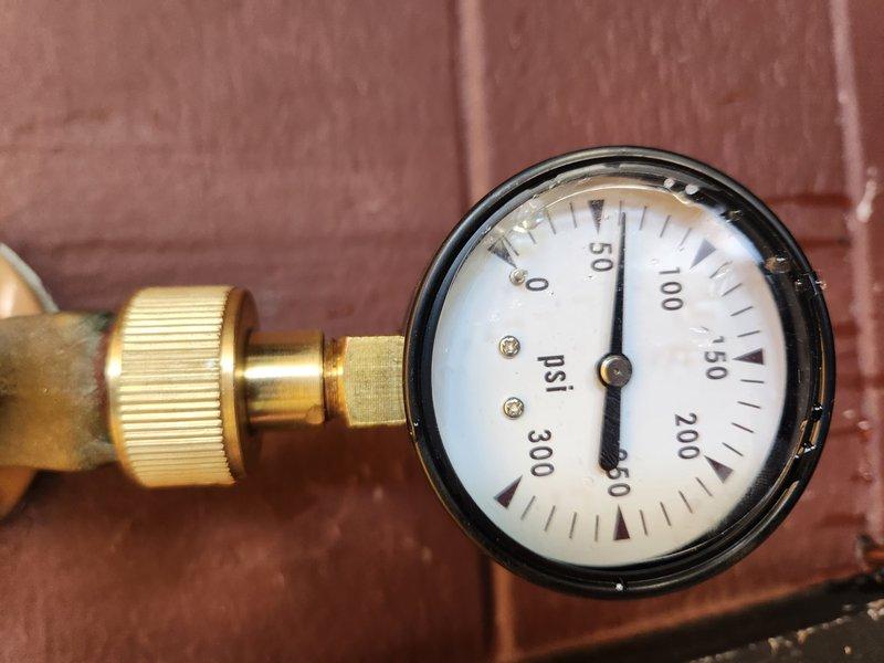 Performed comprehensive plumbing inspection and water heater flush service. Inspected water heater pressure relief valve mechanism, confirming proper operation and seal integrity. Evaluated system pressure using calibrated gauge, verifying readings within normal operating parameters for residential plumbing system.