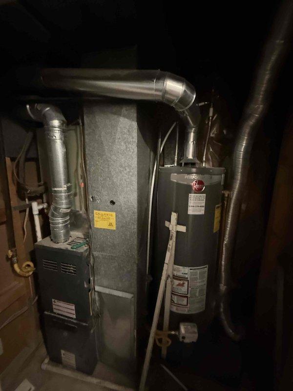 Responded to service call for air conditioning system not blowing cold air. Upon inspection, diagnosed failed capacitor, severely plugged evaporator coil, and rusted fan motor on 24 SEER AC unit with 18 SEER furnace system. Provided estimate for immediate repairs to restore cooling functionality and discussed replacement options for aging HVAC system.