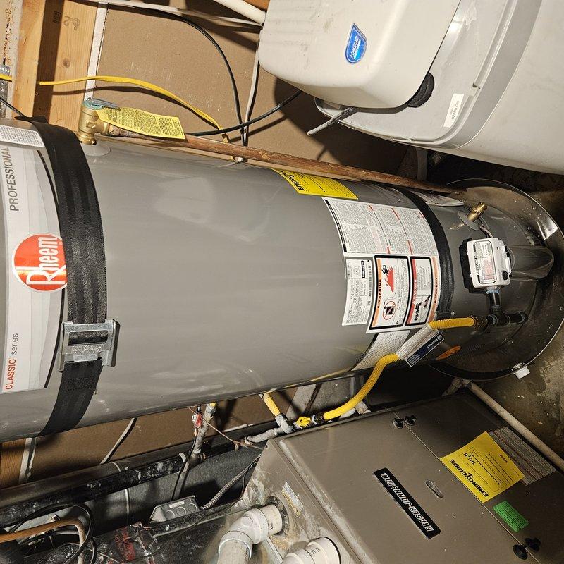 Successfully installed a new 50-gallon Rheem water heater with full code compliance upgrades, including new gas and water connections with shut-off valves and flexible supply lines. Installed thermal expansion tank pressurized to match system requirements, earthquake safety straps, drain pan, and updated venting system with draft hood adapter to meet current code standards. All necessary permits obtained and inspections coordinated with city authorities for final approval.