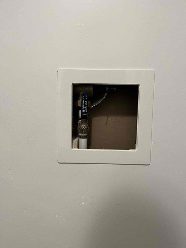 Responded to complaint of low water pressure at exterior hose bibs in 3-year-old residential property with history of frozen pipe damage. Performed comprehensive water pressure diagnostic, including inspection of pressure reducing valve and main water supply system through wall access panels. Testing confirmed PRV functioning properly with pressure readings within normal operating range. Determined low flow issue isolated to hose bib connections rather than systemic pressure problem. Identified deteriorated hose and/or sprinkler head components as probable cause of reduced water flow. Replaced defective hose connections to restore proper water delivery to exterior fixtures.