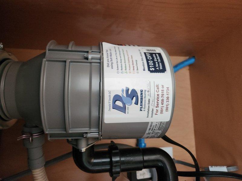 Responded to service call for inoperative garbage disposal unit at residential property. Upon arrival, accessed under-sink cabinet and inspected 4-year-old disposal unit and associated plumbing connections. Customer reported disposal would not turn on and that attempts to manually rotate the impeller using the hex wrench resulted in the entire unit rotating, indicating mounting failure. Diagnosed failed mounting assembly where disposal had separated from sink flange connection. Evaluated P-trap configuration, drain connections, and electrical supply to unit. Determined disposal required replacement due to compromised mounting system and age of equipment. Disconnected existing disposal from electrical supply, P-trap drain line, and dishwasher drain connection. Removed failed unit from sink mounting assembly. Installed new garbage disposal unit with proper mounting ring and support assembly. Reconnected P-trap, dishwasher drain line with appropriate air gap configuration, and restored el