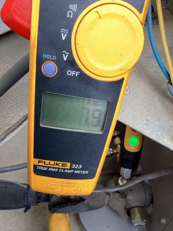 Completed comprehensive cooling maintenance on 5-year-old residential HVAC system including one indoor and one outdoor unit. Performed thorough condenser coil cleaning as requested, inspected electrical disconnect panel and verified all connections secure. Tested system amperage draw reading 79 amps using clamp meter, checked capacitor operation, and confirmed all electrical components functioning within normal parameters. System operating efficiently with no issues found during inspection.