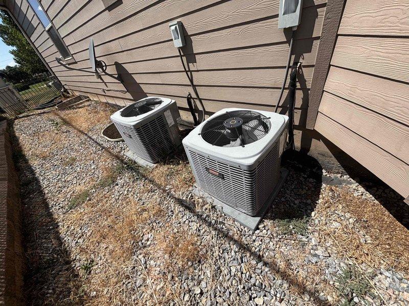 Completed annual Green Shield cooling maintenance on two 11-year-old air conditioning systems serving a multi-level residential property. Performed comprehensive tune-up and inspection on both outdoor condenser units located in side yard on gravel pad, and indoor air handler units positioned in upstairs closet and basement utility space. Inspected refrigerant lines, condensate drain systems, electrical connections, and ductwork on both systems. Verified proper operation of all components including fan motors, compressors, and controls. Both units operating within normal parameters with no reported issues or deficiencies noted during inspection.