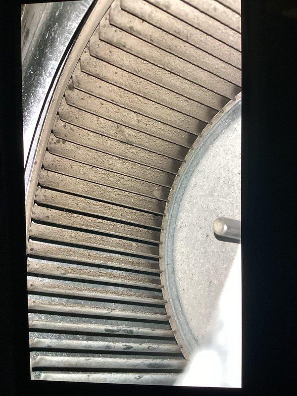 Responded to no-cooling call on single-zone residential HVAC system with outdoor condensing unit and basement furnace installation. Upon inspection, found blower wheel heavily contaminated with dust and debris accumulation, restricting airflow and preventing proper system operation. Cleaned blower assembly, restored airflow, and verified system returned to normal cooling operation.