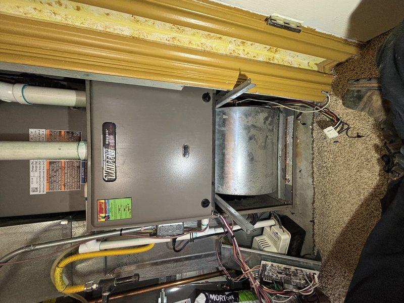 Responded to no-cooling call on single-zone residential HVAC system with outdoor condensing unit and basement furnace installation. Upon inspection, found blower wheel heavily contaminated with dust and debris accumulation, restricting airflow and preventing proper system operation. Cleaned blower assembly, restored airflow, and verified system returned to normal cooling operation.