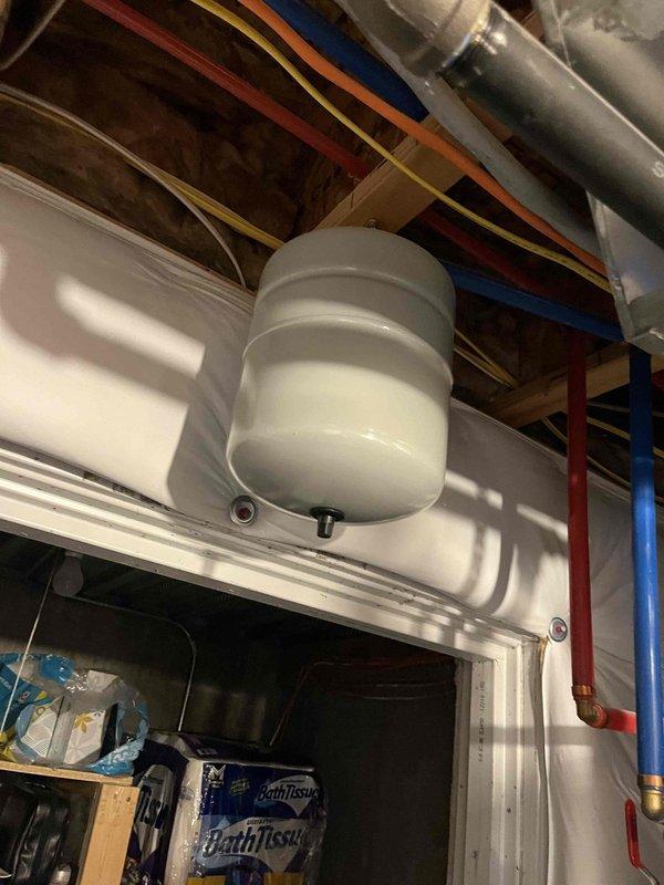 Completed comprehensive plumbing and water heater maintenance inspection as part of Green Shield Protection Plan membership service. Performed thorough visual inspection of residential water heater system, expansion tank, and associated plumbing infrastructure located in mechanical room. Examined white cylindrical expansion tank mounting, connections, and pressure vessel integrity. Inspected copper supply lines including hot and cold water piping, verifying proper color coding and secure connections to water heater unit. Evaluated flexible metal connectors and verified proper installation between water heater and distribution system. Assessed PVC piping runs and connections for proper support and alignment. Documented all mechanical equipment conditions including water heater exterior, expansion tank positioning, and ductwork proximity to plumbing components. Verified proper clearances around equipment and confirmed adequate ventilation in utility space. All systems found to be functio