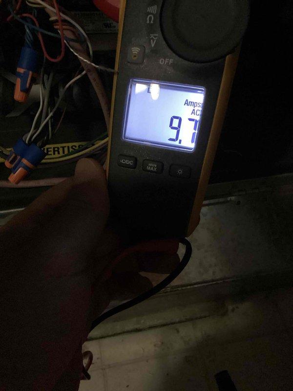 Completed annual cooling maintenance on 4-year-old residential air conditioning system. Performed comprehensive tune-up including electrical diagnostics with amperage draw measurement showing 9.7 amps AC, indicating proper compressor operation. Utilized dual port manometer to verify refrigerant pressures and system performance, recording readings of 0.06 and 0.05, confirming optimal operating parameters. Inspected outdoor condenser unit and indoor components, verified all electrical connections, and provided assistance with thermostat and furnace control operation. System operating within manufacturer specifications with no issues found.