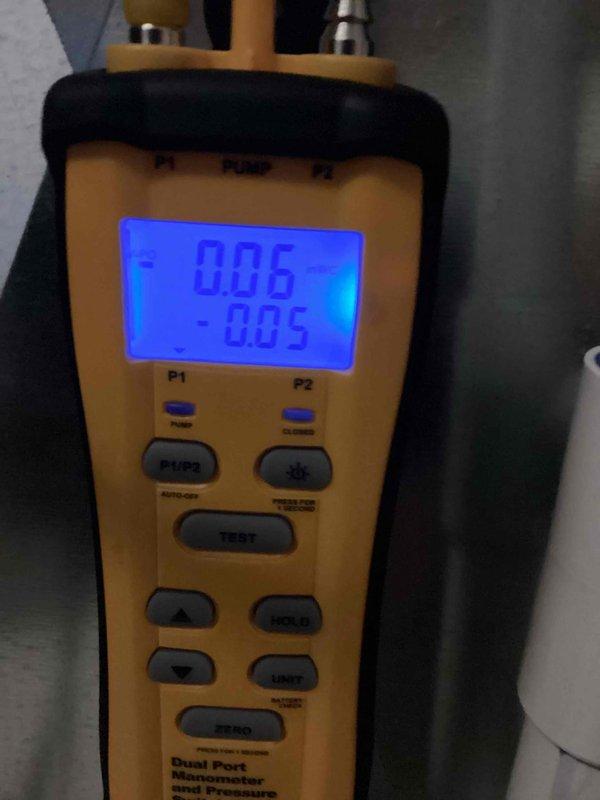 Completed annual cooling maintenance on 4-year-old residential air conditioning system. Performed comprehensive tune-up including electrical diagnostics with amperage draw measurement showing 9.7 amps AC, indicating proper compressor operation. Utilized dual port manometer to verify refrigerant pressures and system performance, recording readings of 0.06 and 0.05, confirming optimal operating parameters. Inspected outdoor condenser unit and indoor components, verified all electrical connections, and provided assistance with thermostat and furnace control operation. System operating within manufacturer specifications with no issues found.