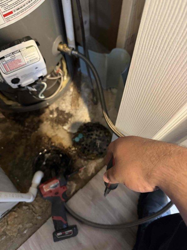 Completed membership plumbing inspection on 5-year-old Rheem tanked water heater located in basement. Inspected unit condition, verified proper operation of water heater components, and examined all plumbing connections including flexible stainless steel braided supply lines and galvanized flue venting system. Checked copper fittings, valves, and associated mechanical equipment. All systems found operating within normal parameters with no immediate service needs identified.