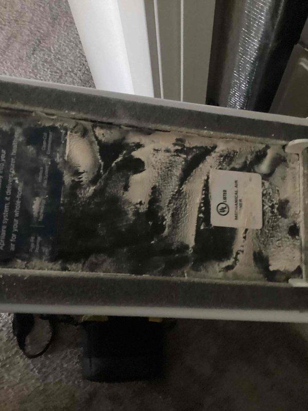 Responded to no cooling complaint on 5-year-old single-zone system with warm air discharging from supply vents. Upon inspection of air handler located in second floor closet, discovered severely restricted airflow due to heavily clogged air filter with excessive dust and debris accumulation. Removed and replaced dirty filter, restoring proper airflow through the system. Inspected interior compartment and noted dust buildup on evaporator coil and drain pan area, which was contributing to reduced system efficiency. System tested after filter replacement and confirmed proper cooling operation with adequate temperature differential across coil and cold air delivery to occupied spaces.