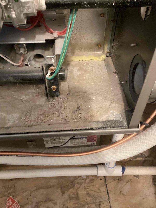 Responded to no cooling complaint on 5-year-old single-zone system with warm air discharging from supply vents. Upon inspection of air handler located in second floor closet, discovered severely restricted airflow due to heavily clogged air filter with excessive dust and debris accumulation. Removed and replaced dirty filter, restoring proper airflow through the system. Inspected interior compartment and noted dust buildup on evaporator coil and drain pan area, which was contributing to reduced system efficiency. System tested after filter replacement and confirmed proper cooling operation with adequate temperature differential across coil and cold air delivery to occupied spaces.