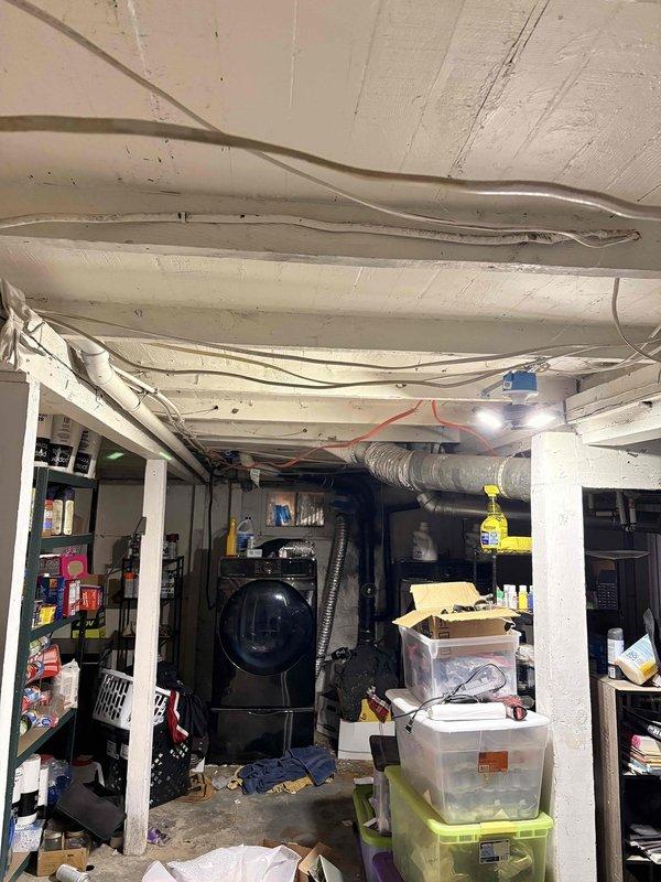 Responded to service call for clogged drain in basement utility area. Assessed plumbing system and successfully cleared blockage from single fixture drain line. Documented existing conditions including basement infrastructure and HVAC equipment location for service records.