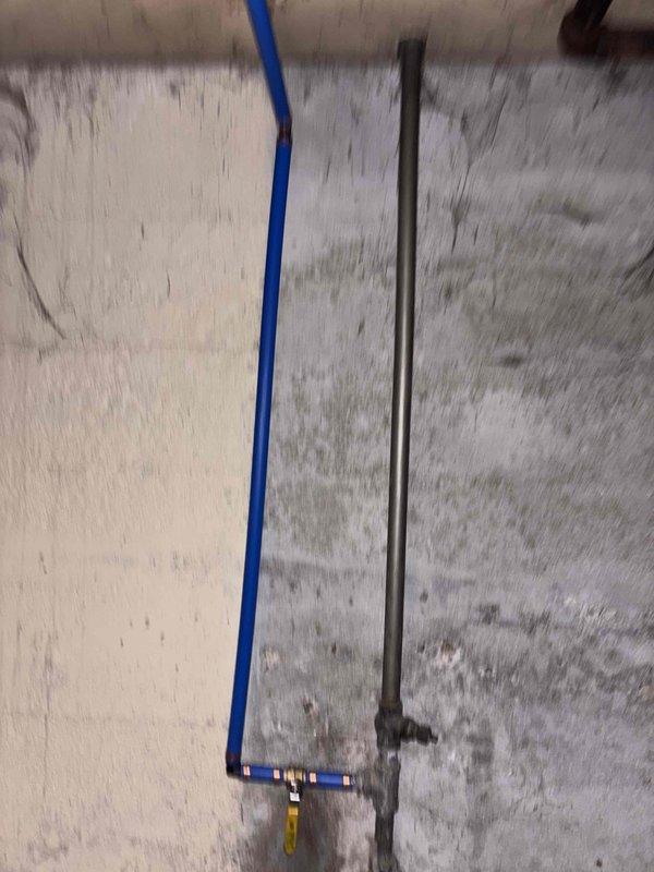 Responded to emergency water leak in basement with active flooding causing property damage. Located failed packing seal on main water supply valve allowing continuous water discharge throughout basement area. Shut off water supply at meter to stop flooding and prevent further damage. Repaired valve by replacing deteriorated packing seal and restoring proper valve function. Tested repair under full water pressure to confirm leak elimination and proper valve operation.