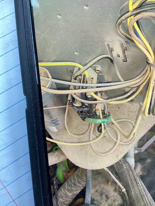 Responded to no-cooling call on residential split system with tripped breaker that would not reset. Performed diagnostic inspection of outdoor condensing unit, model ENDL3X36L17A1 manufactured in 2017, utilizing R-410A refrigerant. Inspected electrical components, wiring connections, and control board within unit housing. Evaluated compressor relay, contactor assembly, and associated low-voltage and line-voltage wiring for shorts or ground faults causing breaker trip. Documented equipment condition with photos showing internal electrical components and manufacturer data plate specifications. System assessed for electrical failure preventing safe breaker reset.