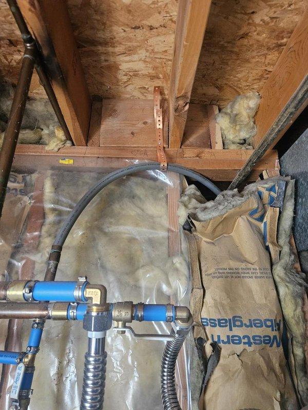 Responded to no hot water complaint on residential gas water heater less than 5 years old. Inspected attic-mounted water heater installation and verified proper operation of burner assembly with blue flame combustion visible through sight glass. Confirmed PEX supply line connections with brass fittings secure and flexible water supply lines properly installed. Unit restored to full operational status with hot water production confirmed.