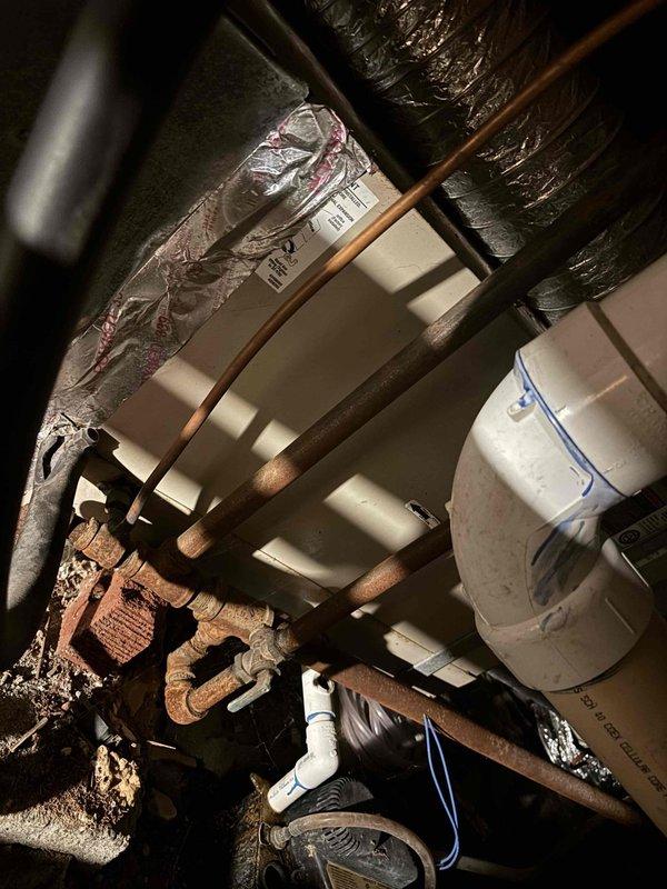 Responded to no-cooling call on residential split system. Upon arrival, verified outdoor unit was not receiving power and indoor system was unresponsive to thermostat commands. Inspected thermostat wiring at wall-mounted control, found loose connections at terminal block affecting multiple low-voltage circuits including R, Y, G, and C wires. Accessed crawl space to inspect furnace and associated wiring, verified proper installation of insulated ductwork and copper refrigerant lines. Tightened all thermostat terminal connections, restored proper wire seating at control board, and cycled system through heating and cooling modes to confirm restoration of functionality. Unit now operating normally with proper communication between thermostat and equipment.