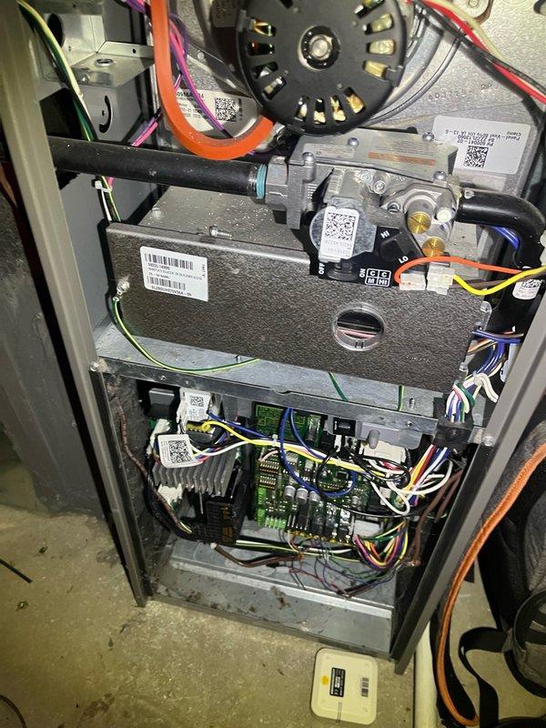 Responded to service call for non-functional external AC unit on 12-year-old residential system. Performed comprehensive Cool 10+ preventive maintenance inspection on furnace system located in basement. Removed access panel and conducted thorough visual inspection of internal components including blower motor assembly, gas valve, and electrical connections. Tested and verified proper operation of control board and capacitors. Utilized digital manometer to measure static pressure readings, recording 0.48 and 0.12 InWC across system pressure points to ensure proper airflow and system performance. Inspected all wire harnesses and electrical connections for secure mounting and proper routing. System returned to normal operation following diagnostic evaluation and maintenance procedures.