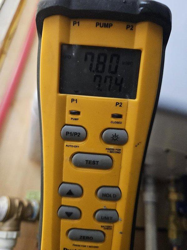 Responded to service call for 1-year-old Navien tankless water heater requiring repeated manual resets to restore hot water operation. Performed diagnostic evaluation of unit control panel displaying 127°F and utilized pressure testing equipment to assess system performance and identify underlying cause of intermittent failure requiring customer intervention to maintain hot water supply.