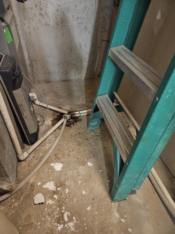 Responded to service call for non-operational water heater at residential property. Upon arrival, accessed basement utility area and inspected wall-mounted Navien tankless water heating unit. Removed front access panel to evaluate internal components including heat exchanger, blower assembly, control board, and gas valve connections. Observed digital display showing error code 180.1, indicating potential issue with internal sensor or operational parameter. Verified all PVC exhaust and intake venting connections secure at top of unit. Inspected control board, wiring harnesses, and electrical connections for signs of failure or loose connections. Evaluated heat exchanger condition, copper and plastic tubing connections, and gas valve assemblies for proper operation. Assessed blower motor and fan assembly functionality. Documented unit condition with photographic evidence showing internal components and installation environment. Provided diagnostic findings and recommended repair options 