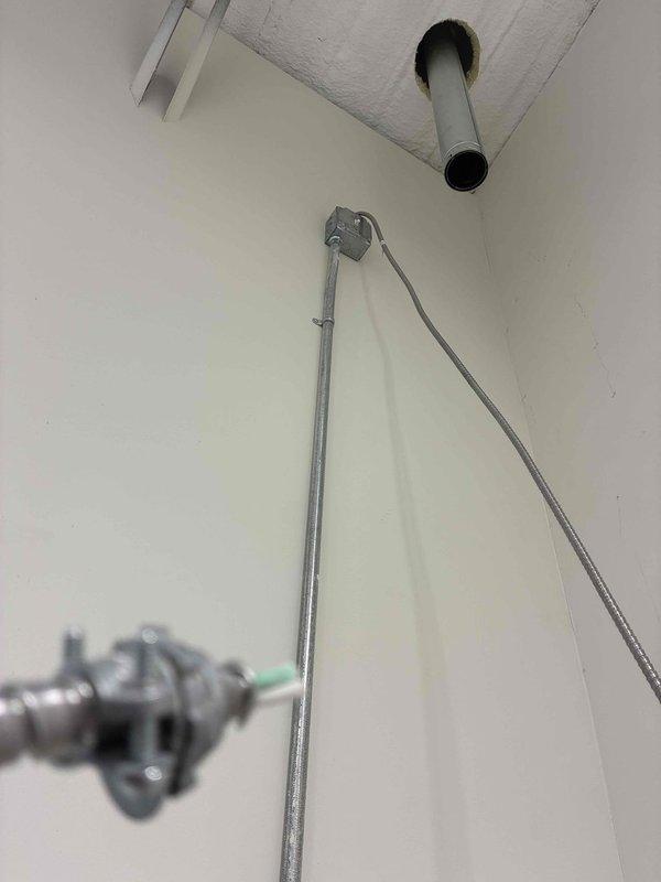 Completed installation of new shop heater unit in mechanical room. Mounted heater to wall using secure bracket system and completed all electrical wiring connections to power the unit. Flue and venting system were previously installed and verified for proper integration with new heater. Due to weight of equipment, utilized lifting assistance to safely position and secure the unit. All electrical connections tested and verified operational upon completion.
