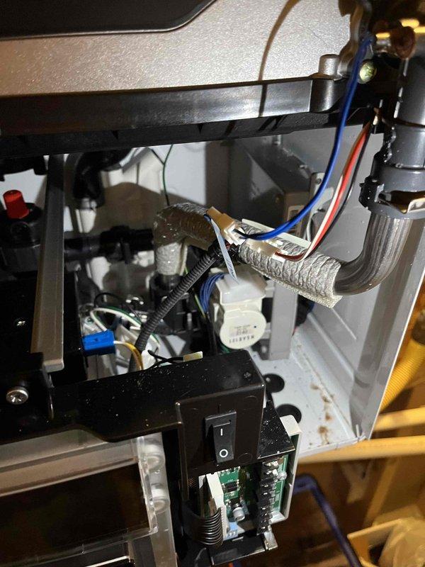 Responded to no hot water condition on 4-year-old Navien tankless water heater displaying "check CB PCB connections" error code. Performed diagnostic inspection and discovered significant corrosion on the condensing heat exchanger assembly. Temporarily restored hot water functionality, though longevity uncertain due to extent of corrosion damage. Identified potential venting and condensation issues as contributing factors requiring further investigation. Additional diagnostic testing needed to determine root cause and develop comprehensive repair solution.