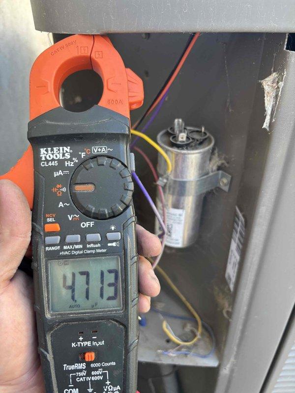 Responded to service call for central air conditioning system with reported condenser malfunction and icing condition. Upon arrival, confirmed unit had been disconnected from power by homeowner. Performed diagnostic evaluation of system components including electrical measurements at capacitor and contactor assembly, recording amperage draw of 47.13 amps using digital clamp meter. Inspected blower wheel assembly for debris accumulation and proper operation. Identified condenser control issue preventing unit from cycling off properly, which contributed to coil freeze-up. Allowed sufficient time for ice to melt from evaporator coil before proceeding with testing. Verified capacitor values, checked all electrical connections at control board, and tested thermostat communication. Restored power to system and monitored operation through complete cooling cycle to ensure proper function and automatic shutdown capability.