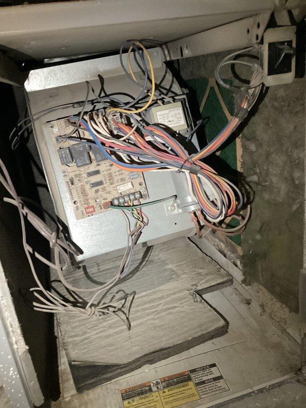 Responded to service call for 22-25 year old residential air conditioning system with non-operational condenser fan motor and failing compressor. Performed diagnostic evaluation of outdoor unit and confirmed fan motor failure despite recent capacitor replacement by homeowner. Assessed compressor condition and determined unit had reached end of serviceable life. Presented repair options and full system replacement recommendations for the single-zone HVAC system with basement furnace installation.