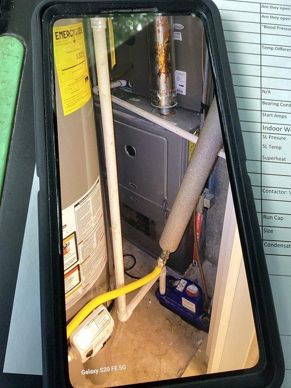 Responded to no-cooling call on 2-3 year old residential AC system. Upon arrival, verified unit would not start and thermostat was functioning properly. Inspected outdoor condensing unit in backyard and indoor air handler/furnace in basement. Examined electrical control board and found failed contactor preventing compressor from engaging. Replaced defective contactor, verified proper voltage and amperage at all connections, and tested system operation. Unit now cooling properly with normal temperature differential across evaporator coil.