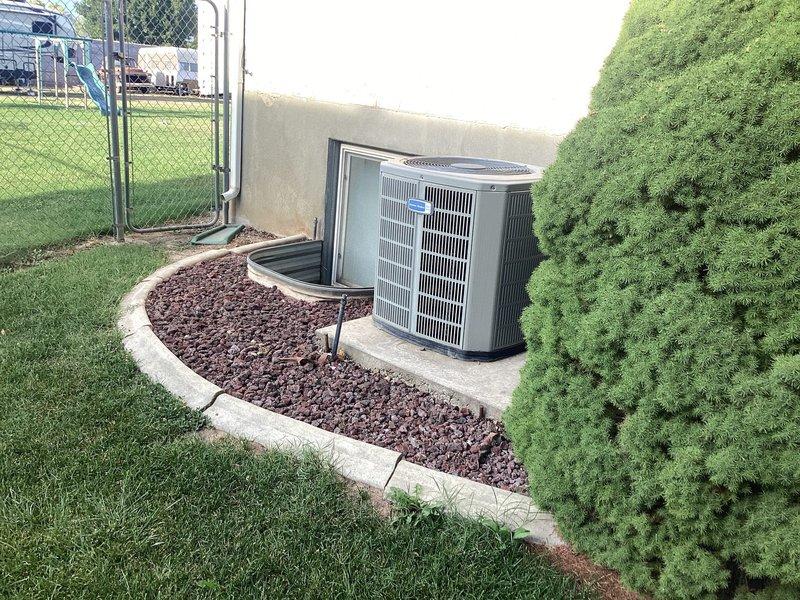 Responded to callback for recurring cooling issue on 8-9 year old system with frozen evaporator coil. Previous visit identified restriction in refrigerant system causing inadequate cooling performance. Inspected outdoor condenser unit located in side yard and indoor air handler with ductwork in basement. Confirmed system restriction remains unresolved, requiring either extensive refrigerant system repairs or full system replacement. Provided customer with repair options ranging from component-level fixes to complete equipment upgrade, awaiting decision on how to proceed with resolution.