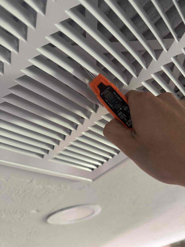 Responded to no cooling complaint on 1-year-old residential AC system. Performed diagnostic evaluation of outdoor condensing unit and indoor air handling components, inspected blower wheel assembly showing normal dust accumulation, and measured airflow at supply registers to verify system performance. System operational at time of inspection.