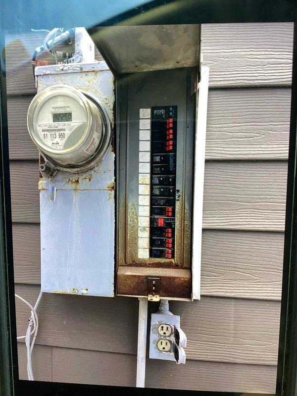 Completed a 100-amp meter socket and load center upgrade with main breaker rated for 16/24 circuits. Installed NEMA 3-rated weatherproof panel, new riser with weatherhead and guy wire support, service entrance cable (SER), proper panel grounding system with dual ground bars and grounding conductors. Coordinated with utility company for meter disconnect and power shutdown, obtained required permit, and set up temporary power to maintain air conditioning during installation. Replaced corroded meter base and mounting hardware, installed new weatherproof disconnect, and established compliant conduit runs connecting all components. All work completed to code specifications and passed final inspection.